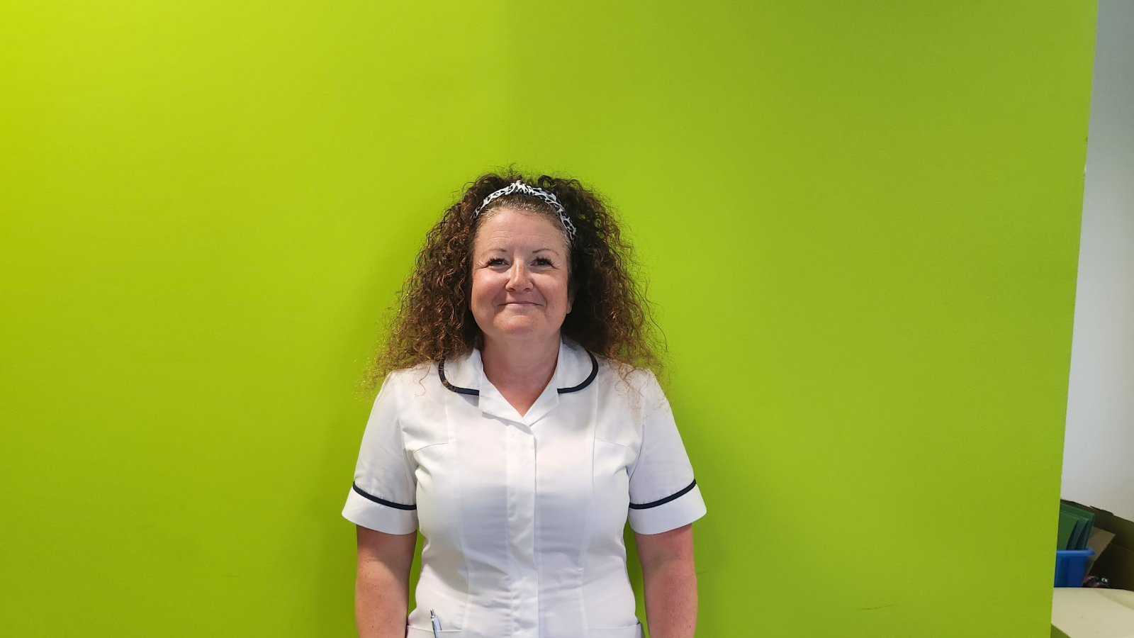 physiotherapy lead Leanne Walters poses happily at her work after cataract surgery