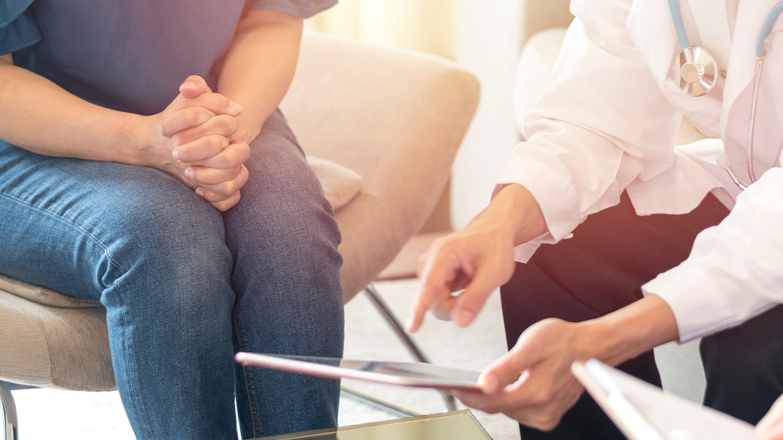 consultant helping a patient with gynaecological problems