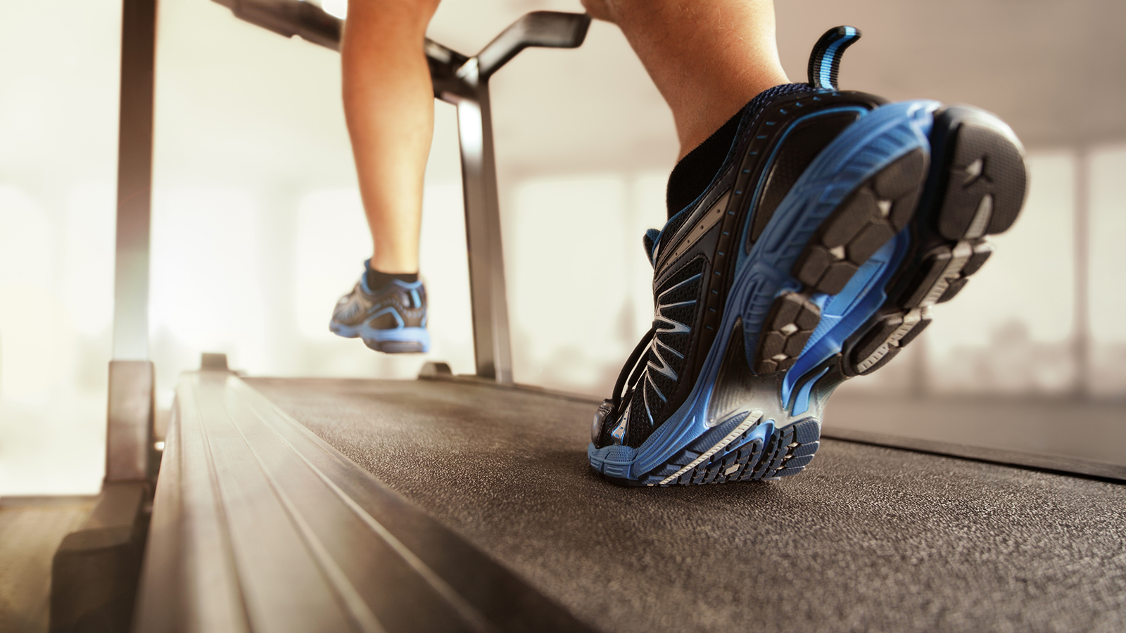 man running on a treadmill during gait analysis physiotherapy