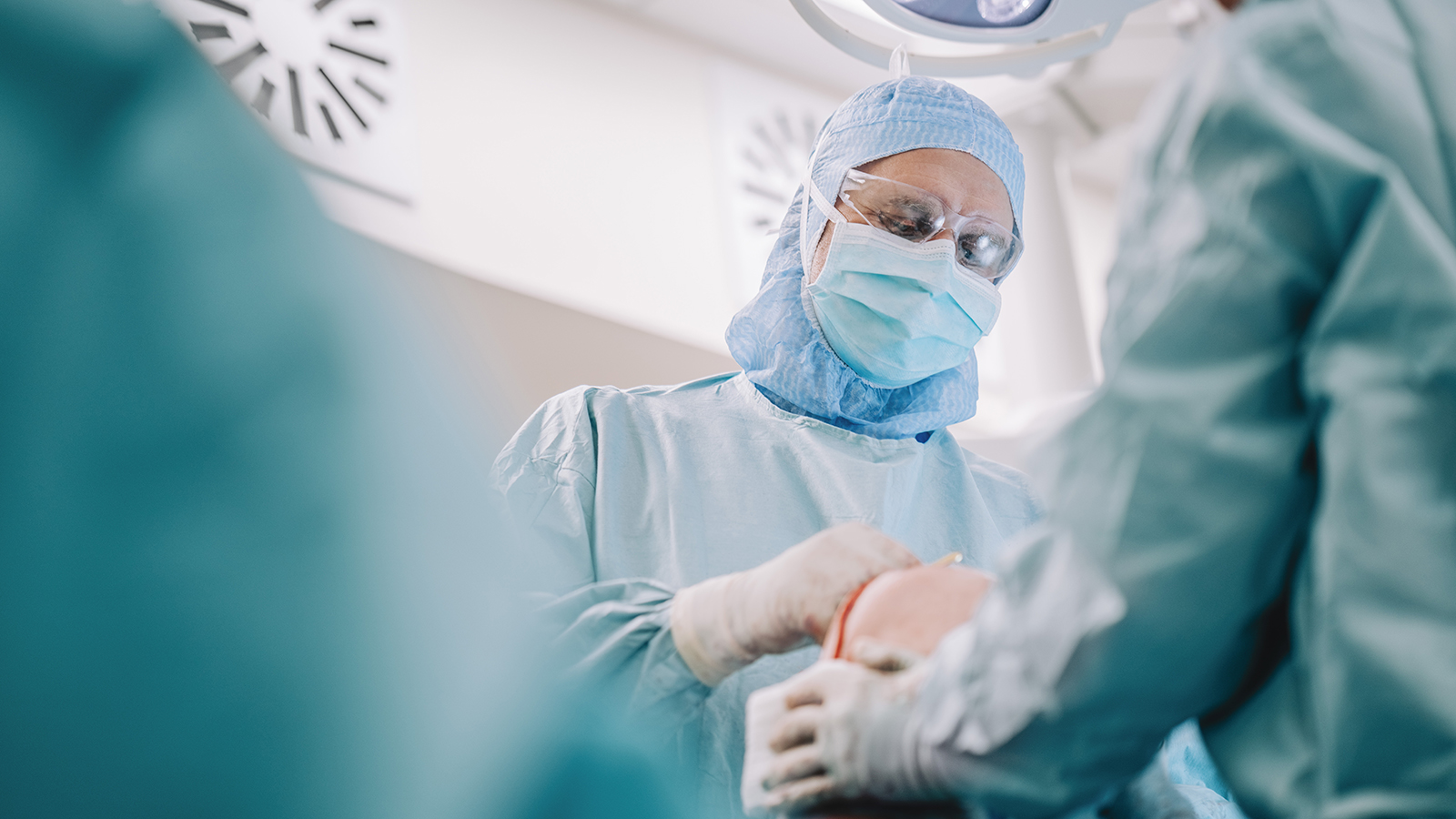 surgeons performing a knee replacement