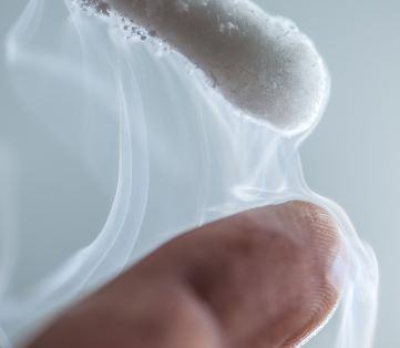 close up of a finger being treated with cryotherapy
