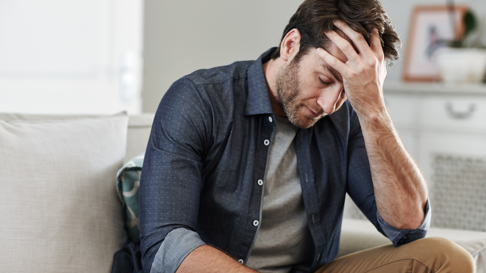 Man feeling sad due to potential gynaecomastia
