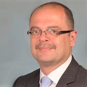 Portrait of Dr Mohamed Alrawi , Consultant Dermatologist