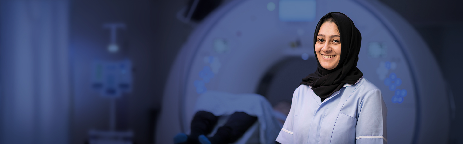 female radiographer with scanning equipment