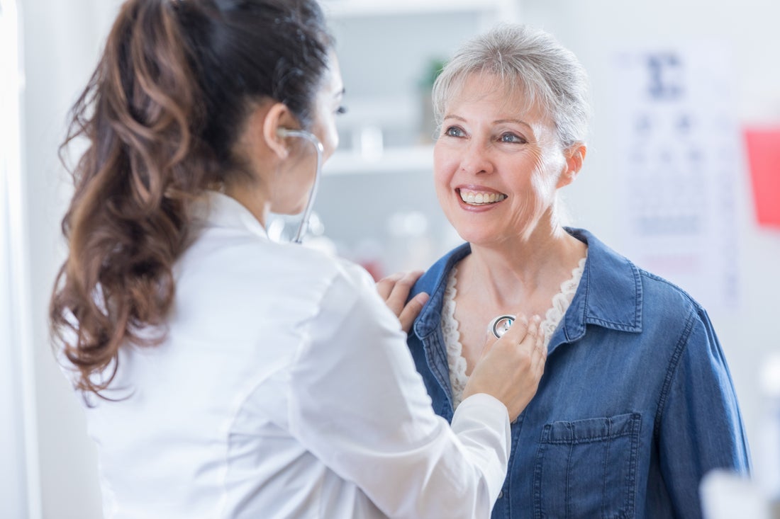 Nurse assessing a cardiology patient