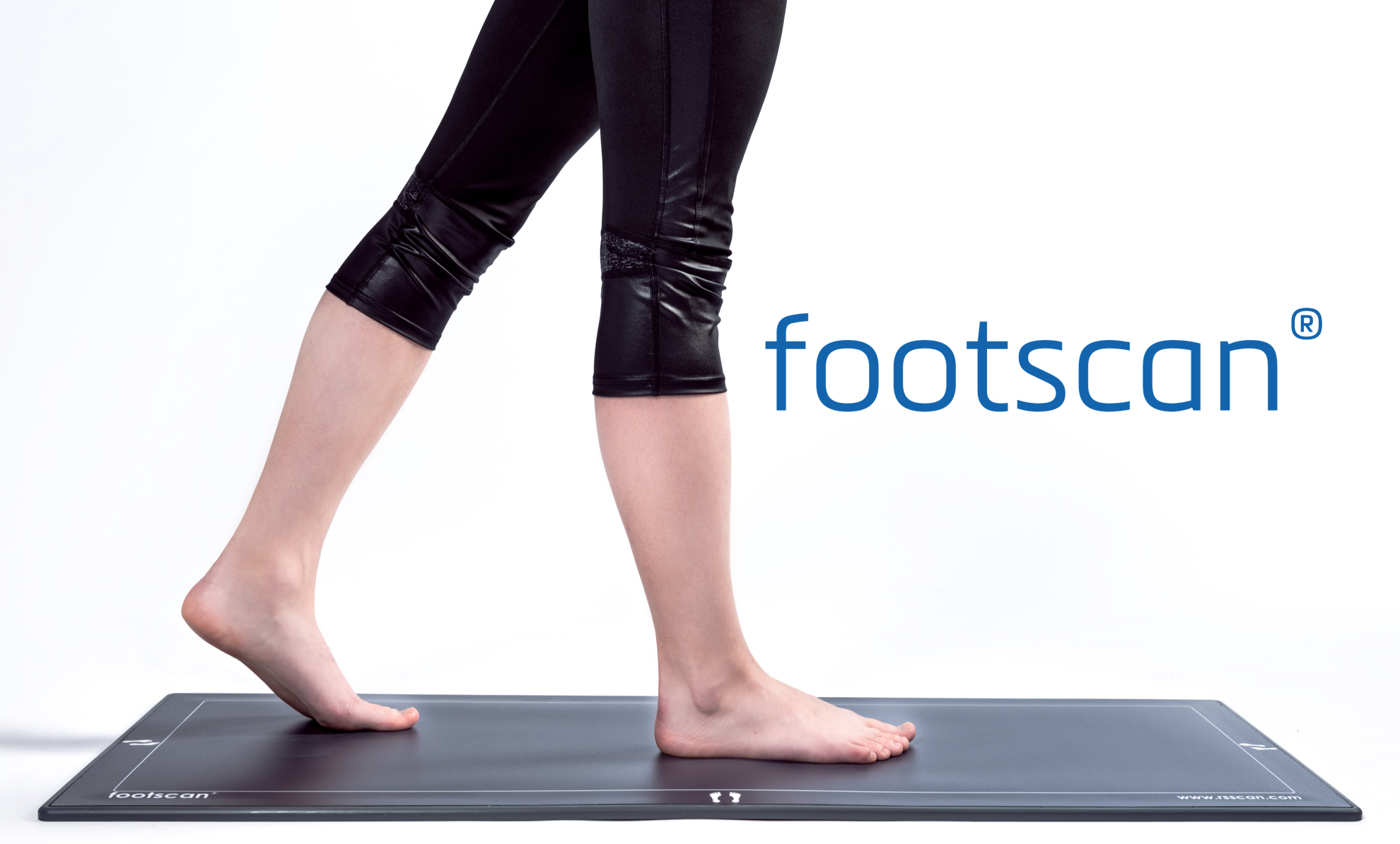 A person walking on a pressure pad used in Footscan technology for gait analysis