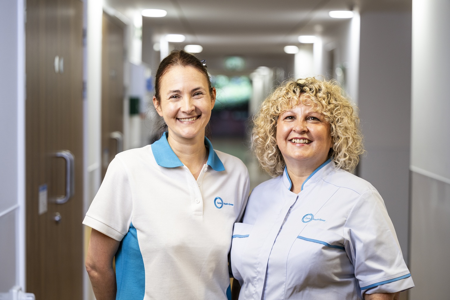 Private hospital staff members smiling