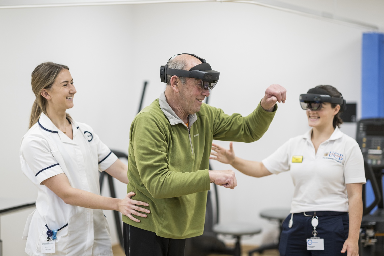 Private hospital staff members with rehabilitation patient