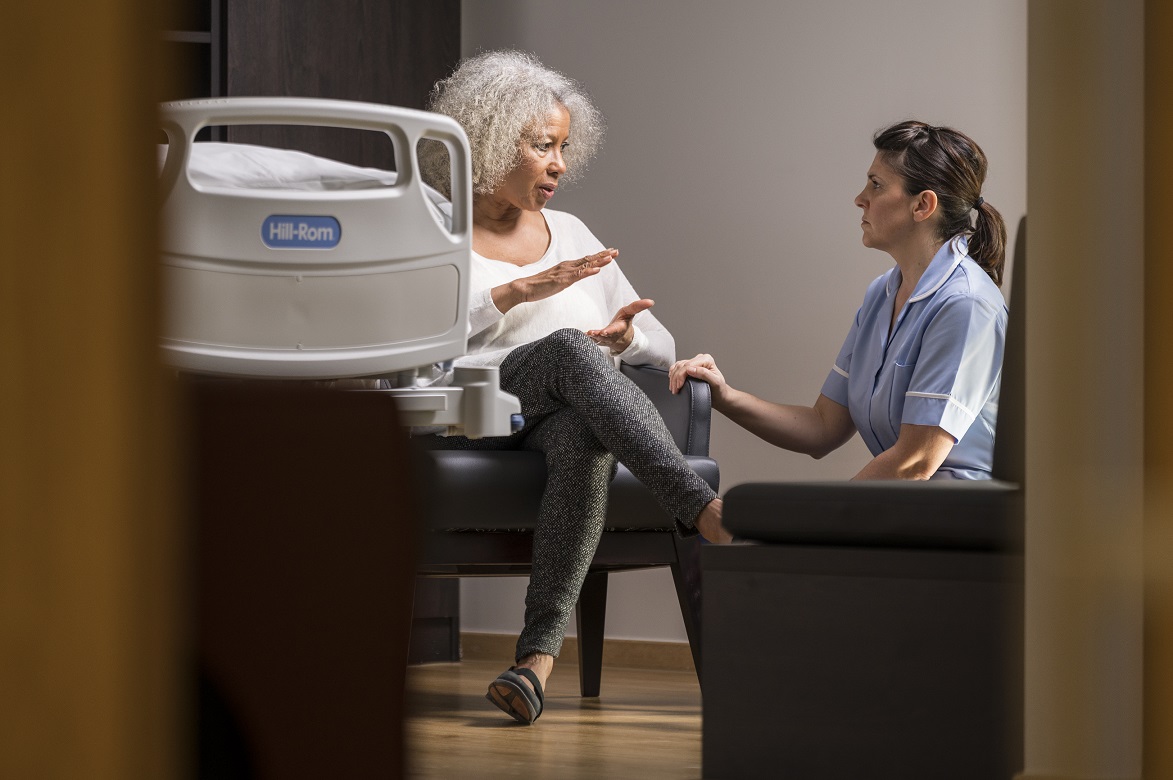 Concerned patient talking to nurse