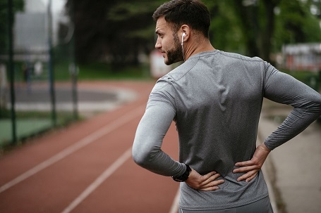 Man with back pain from sports