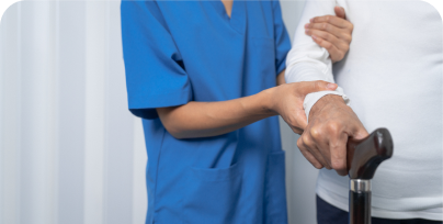 nurse supporting patient with a walking stick