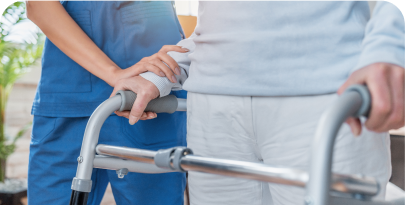 patient using a walker with help of a nurse