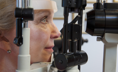 Senior woman being examined for macular degeneration