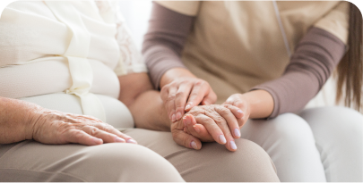nurse holding patients hand