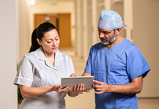 Nurse and doctor reviewing notes