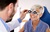 Senior woman taking an eyesight test examination at an eye clinic