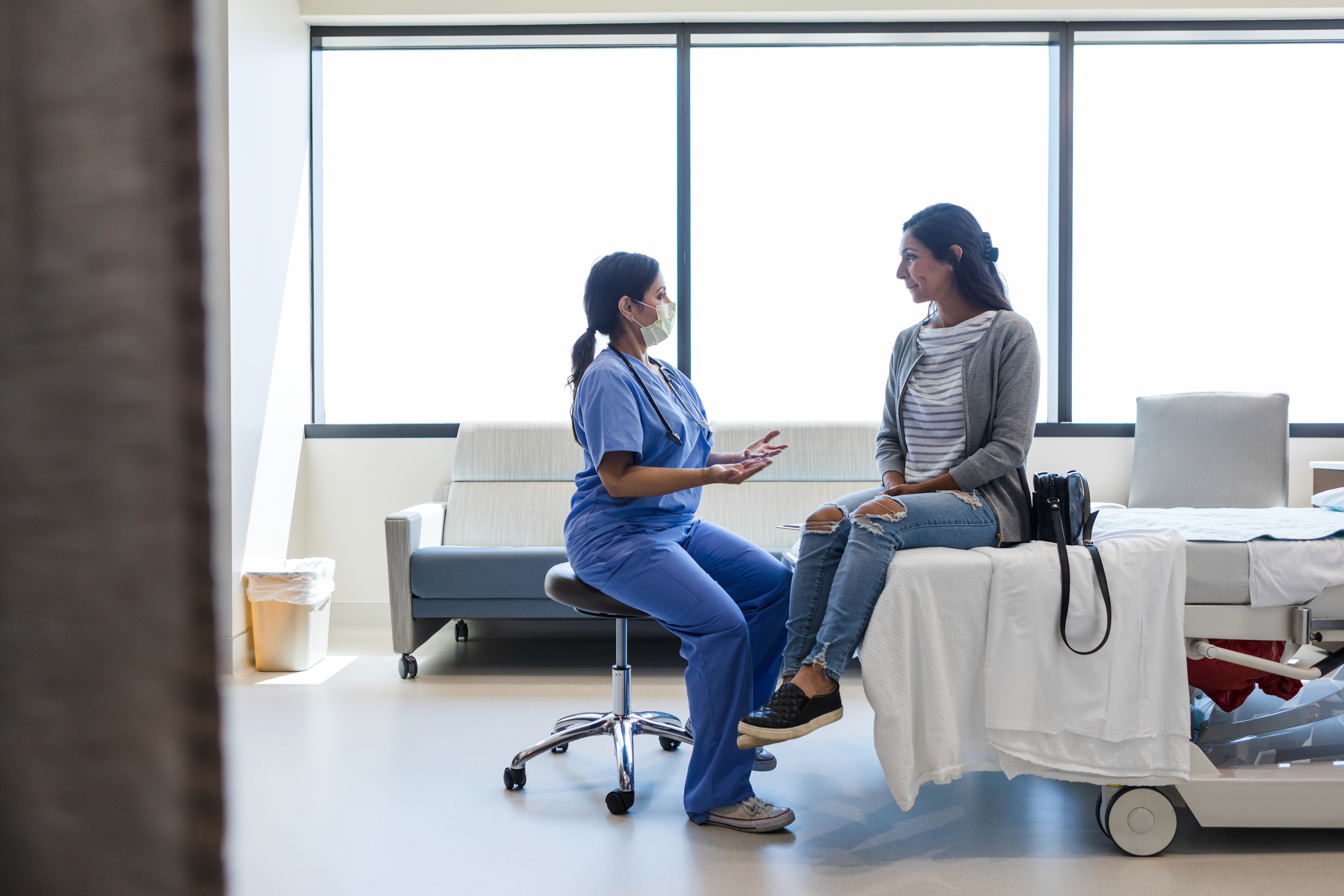 Female patient talking with a female doctor