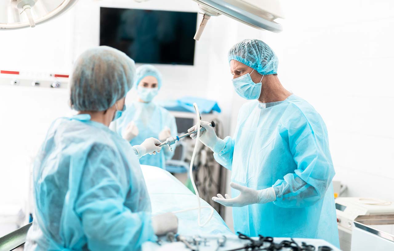Doctor using pen to point at uterus model