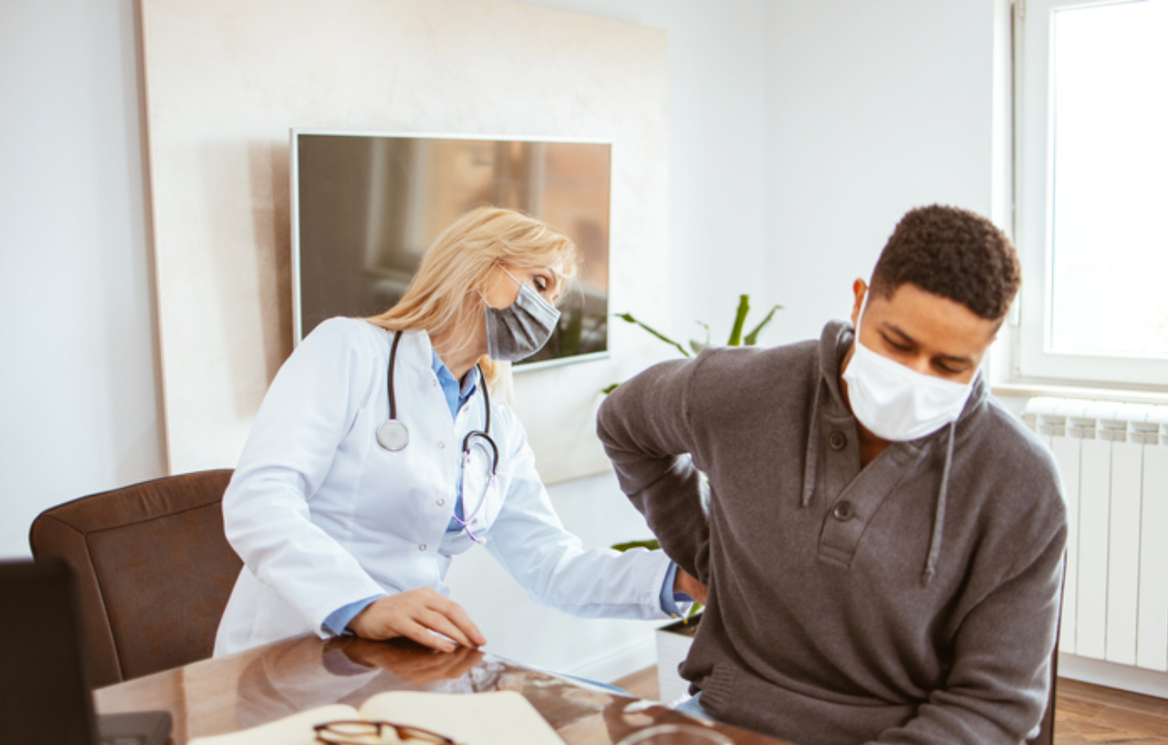 Kidney cancer treatment with doctor examining patient
