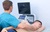 Echocardiography-Doctor-examining-patient-heart-by-using-ultrasound-equipment