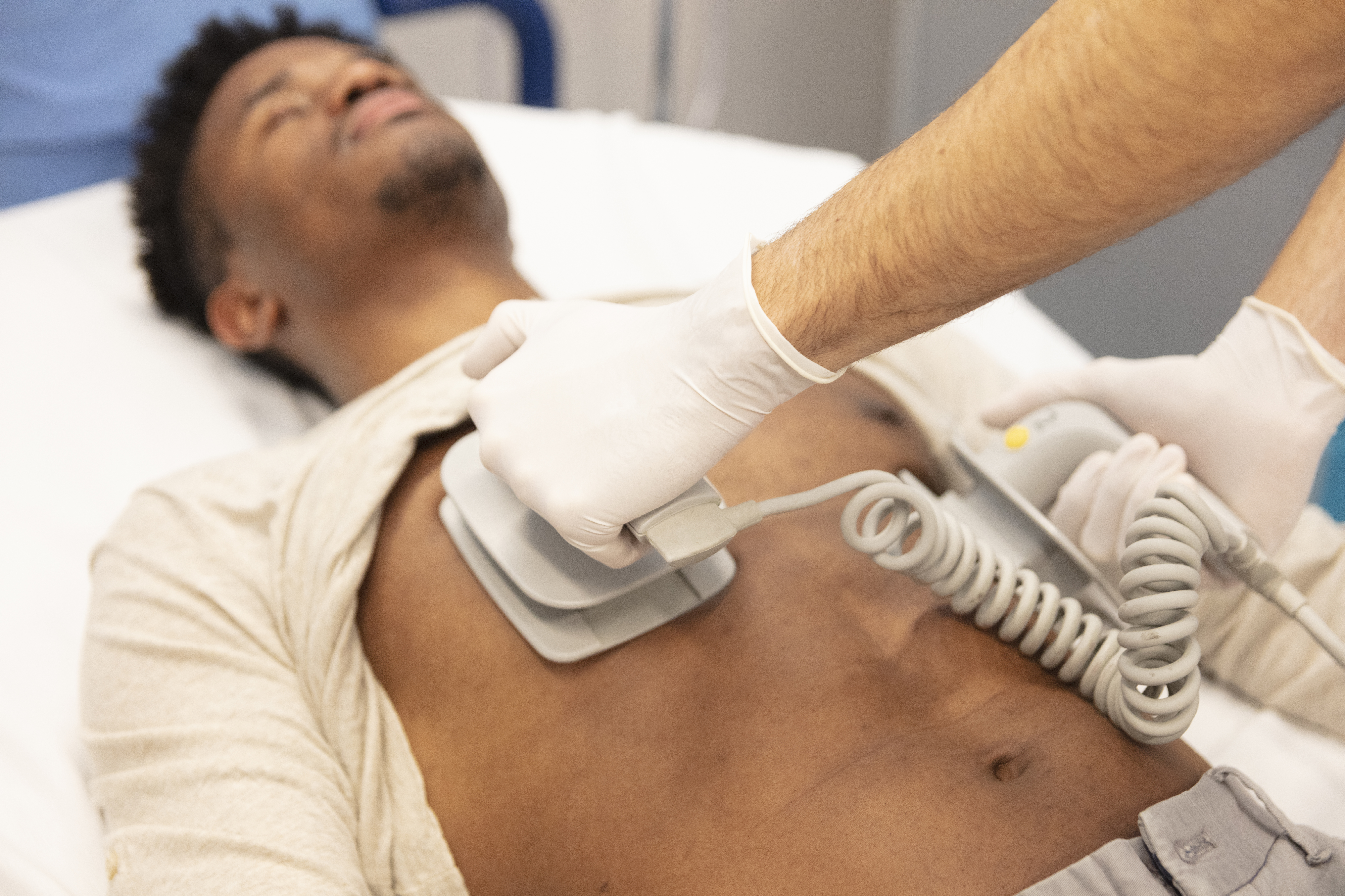 A man getting electrical cardioversion on the chest 