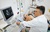 Cardiologist performs cardiovascular screening using an ultrasound machine