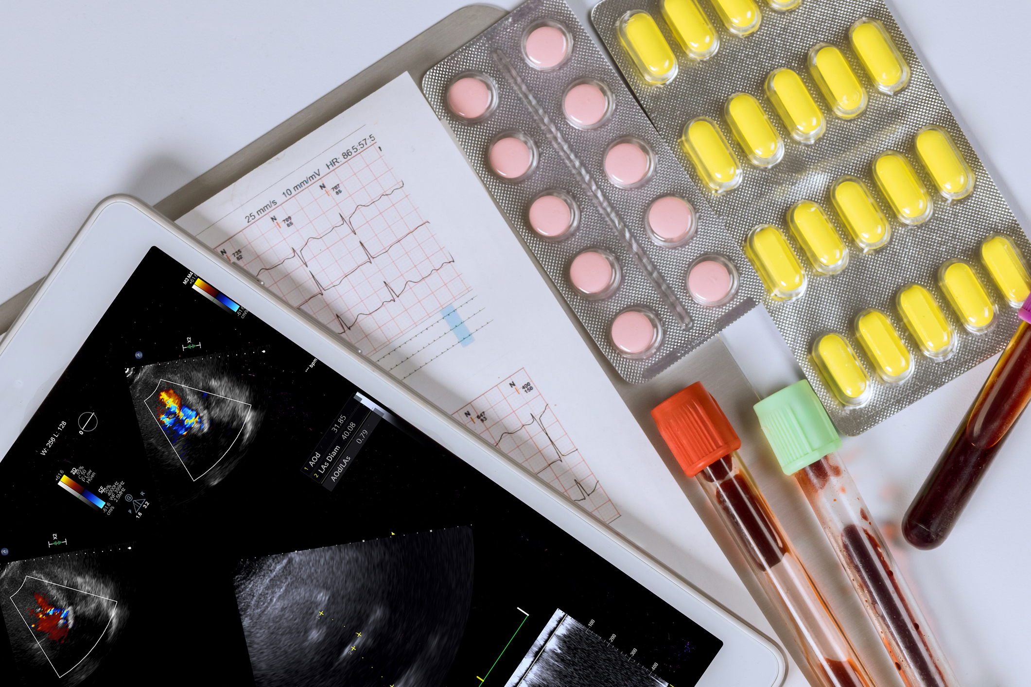 A table with an assortment of diagnostic results and tablets