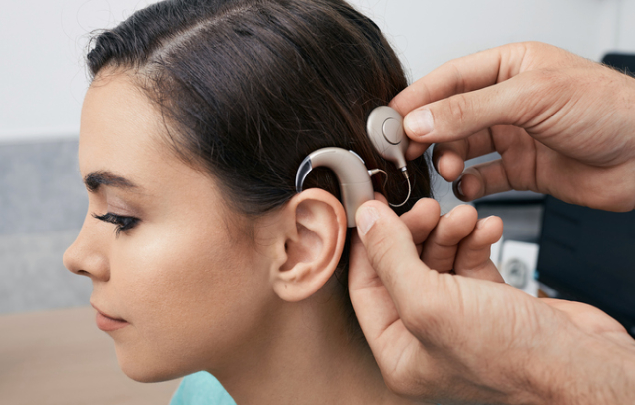 Cochlear implant being fitted on a young female patient