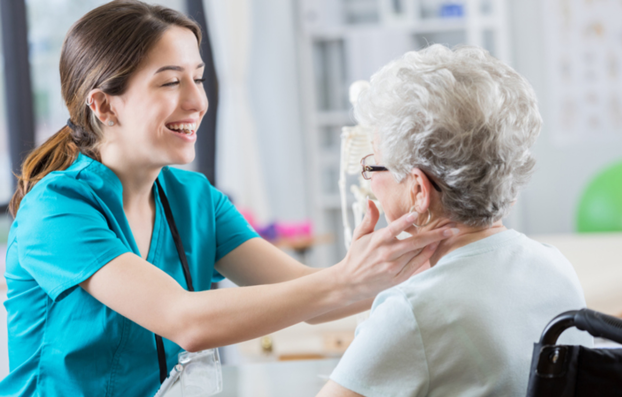 Nurse examines a patient's neck after stroke prevention surgery (carotid endarterectomy)
