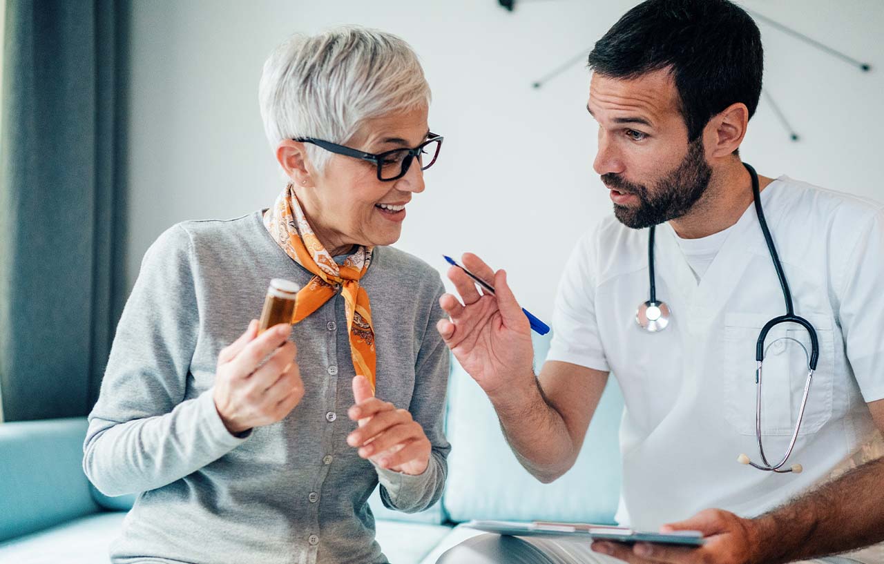 Gynaecologist talks through menopause treatment options with a patient