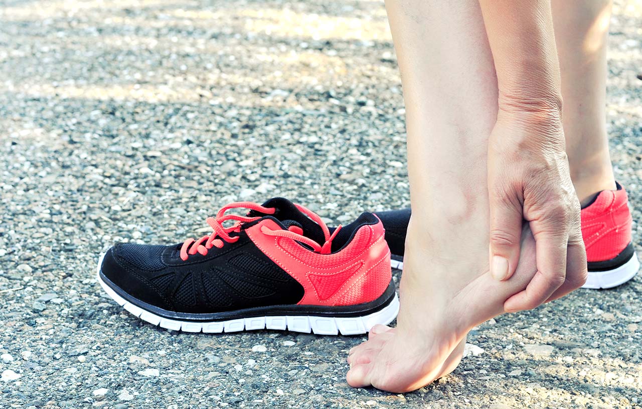 Woman running with a painful heel may have Achilles tendinopathy
