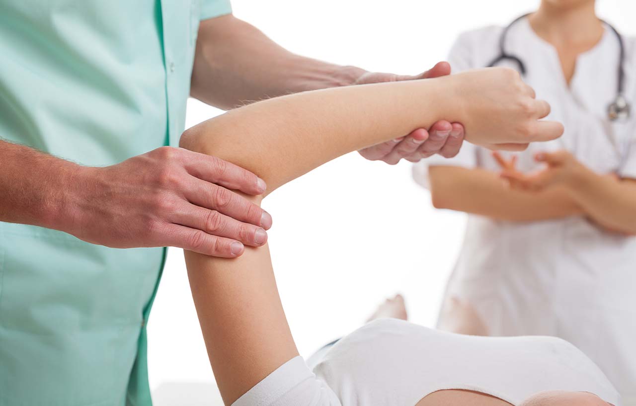 Examination in clinic to assess for elbow arthritis