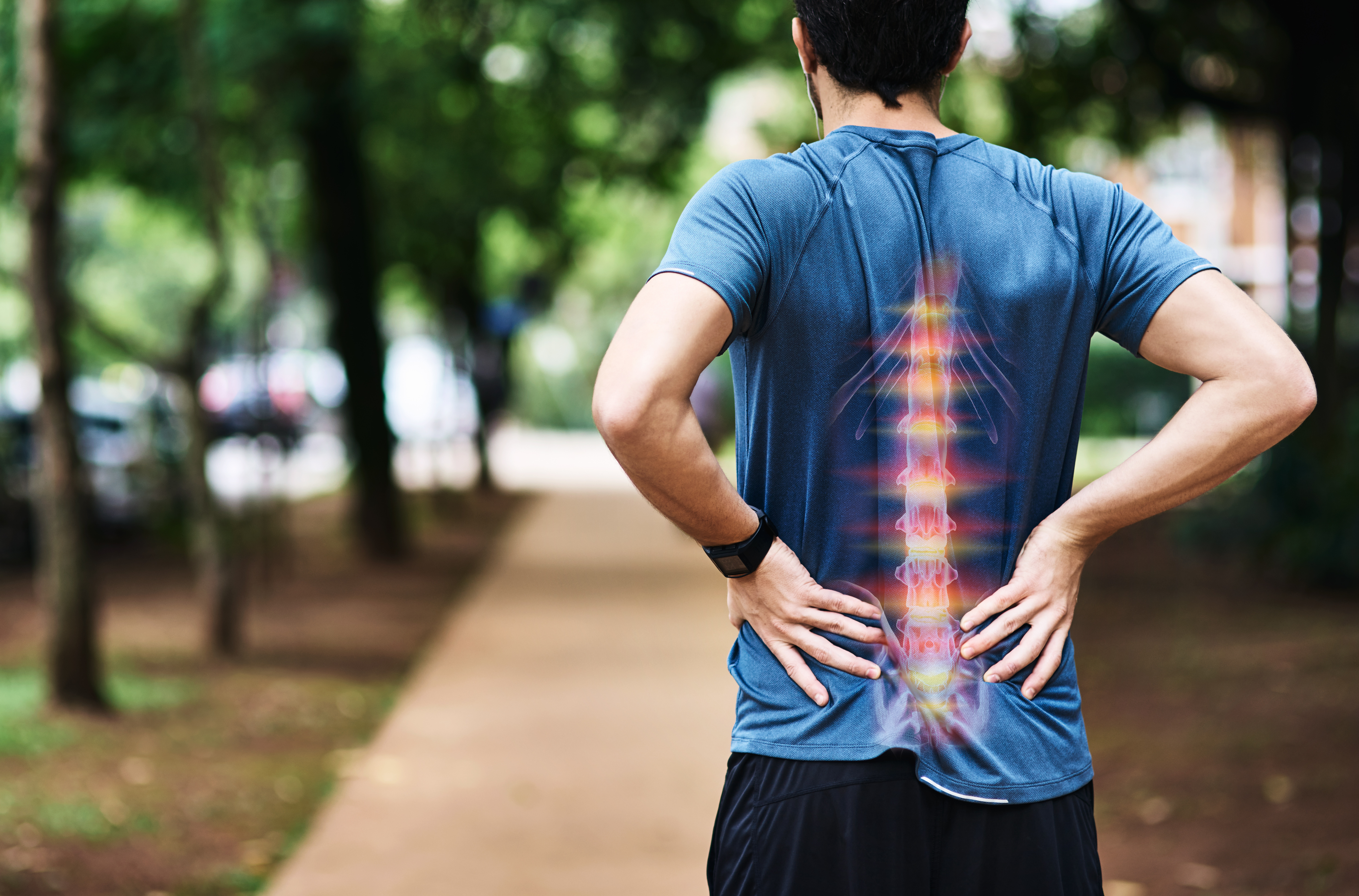 A man suffers from pain in his back