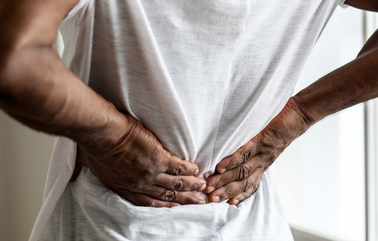 Man suffering from pain in his lower back