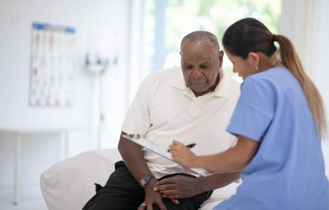 Clinician explaining haemorrhoidal artery ligation (HALO) to a patient