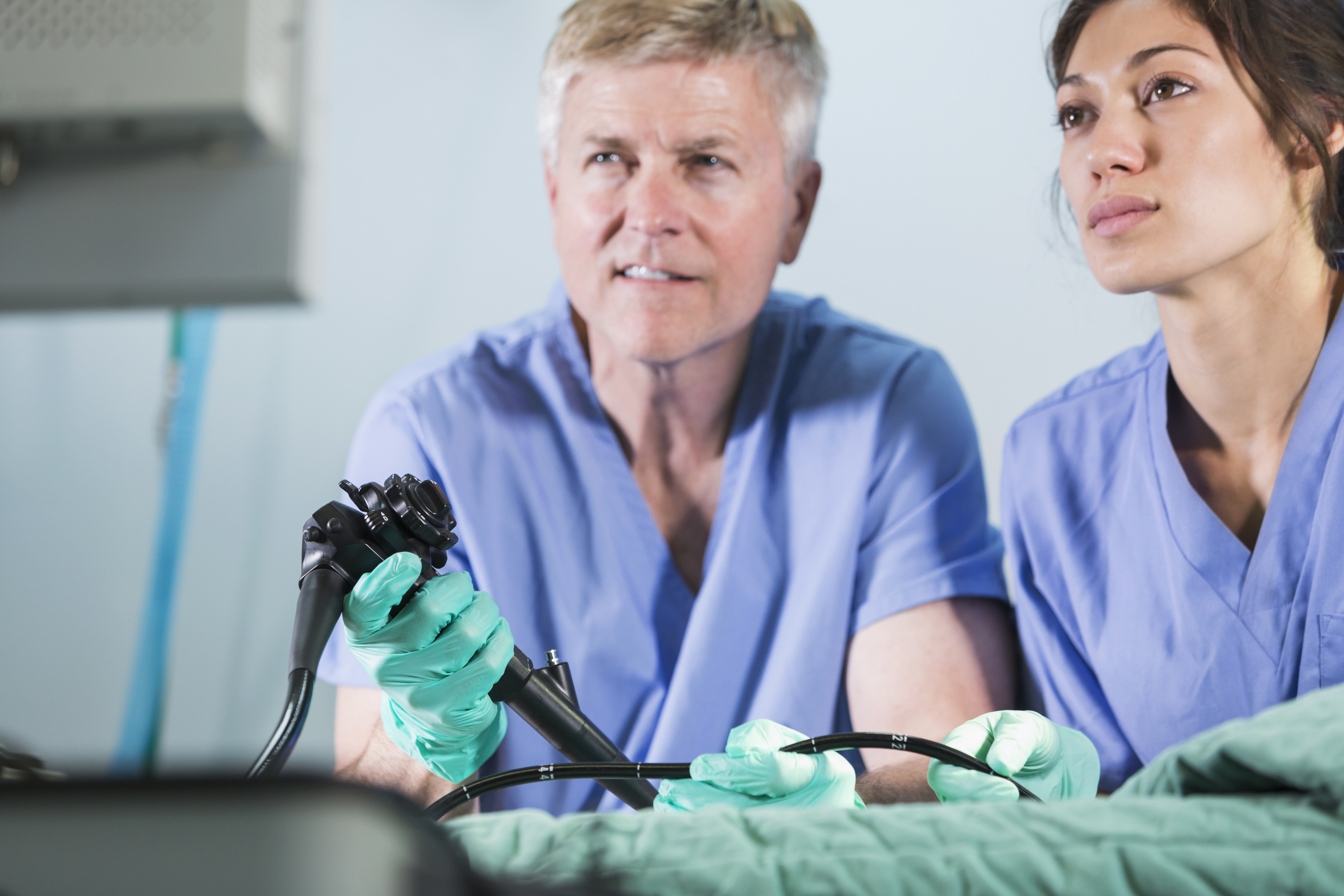 Two doctors using an endoscope