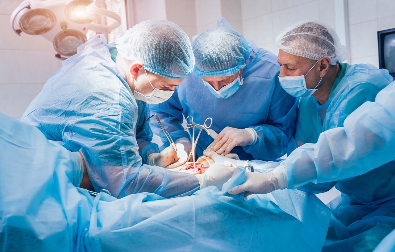 Surgeon and theatre team perform foot arthritis procedure