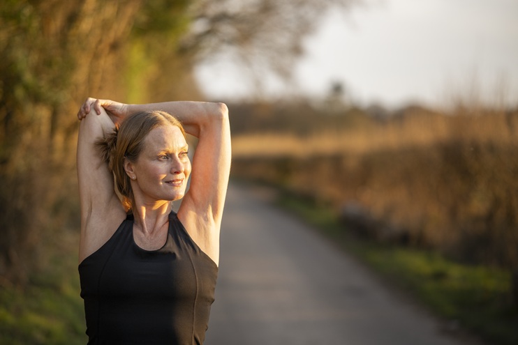 Woman outside exercising running