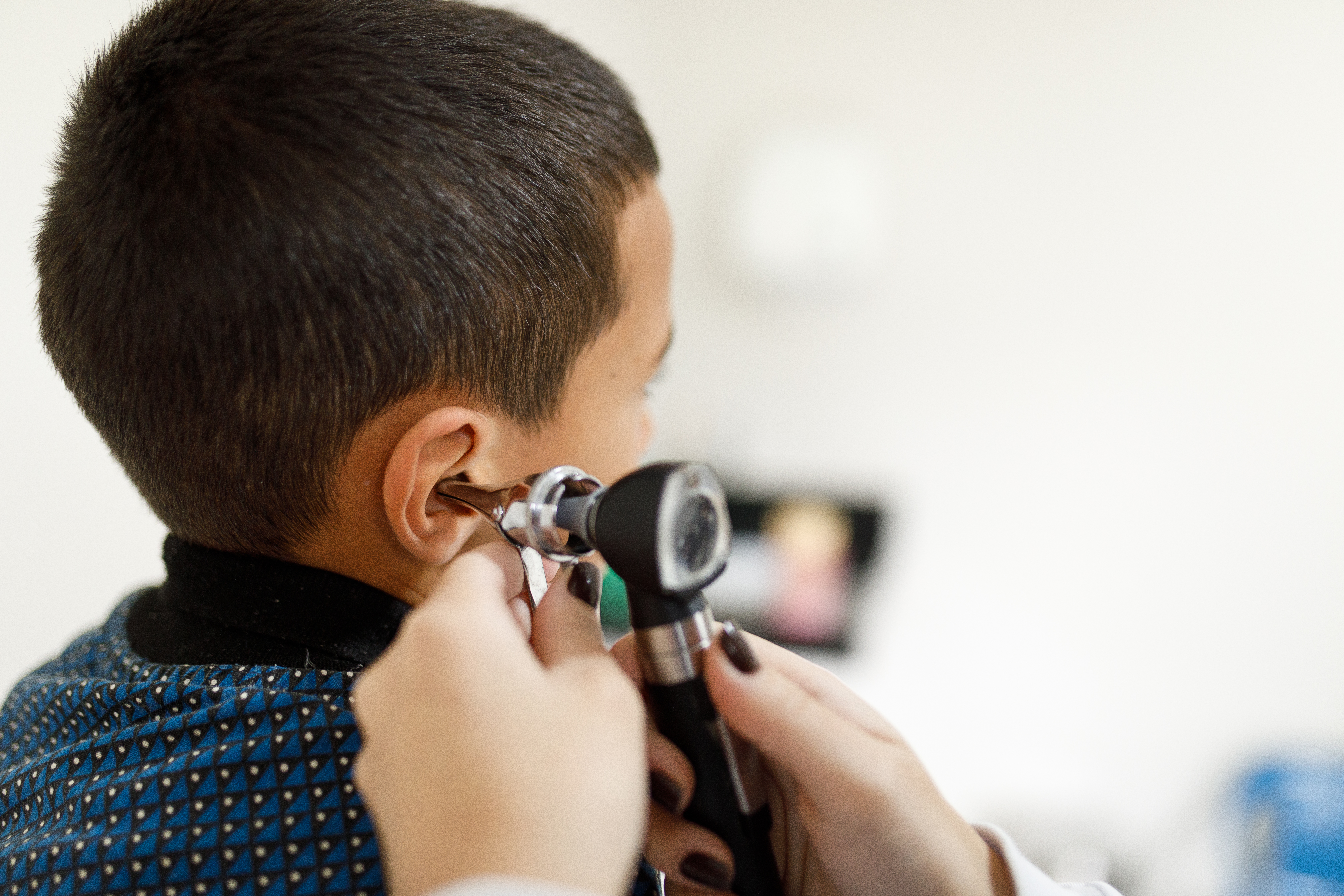 A child getting an ear examination