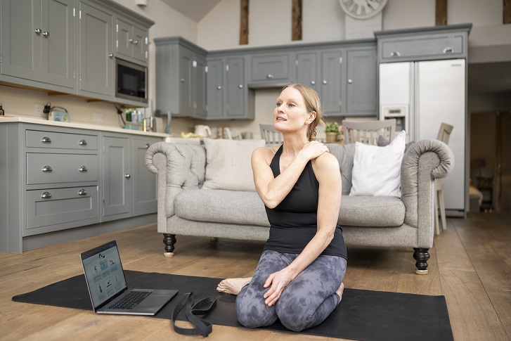 Woman doing at home physio exercises