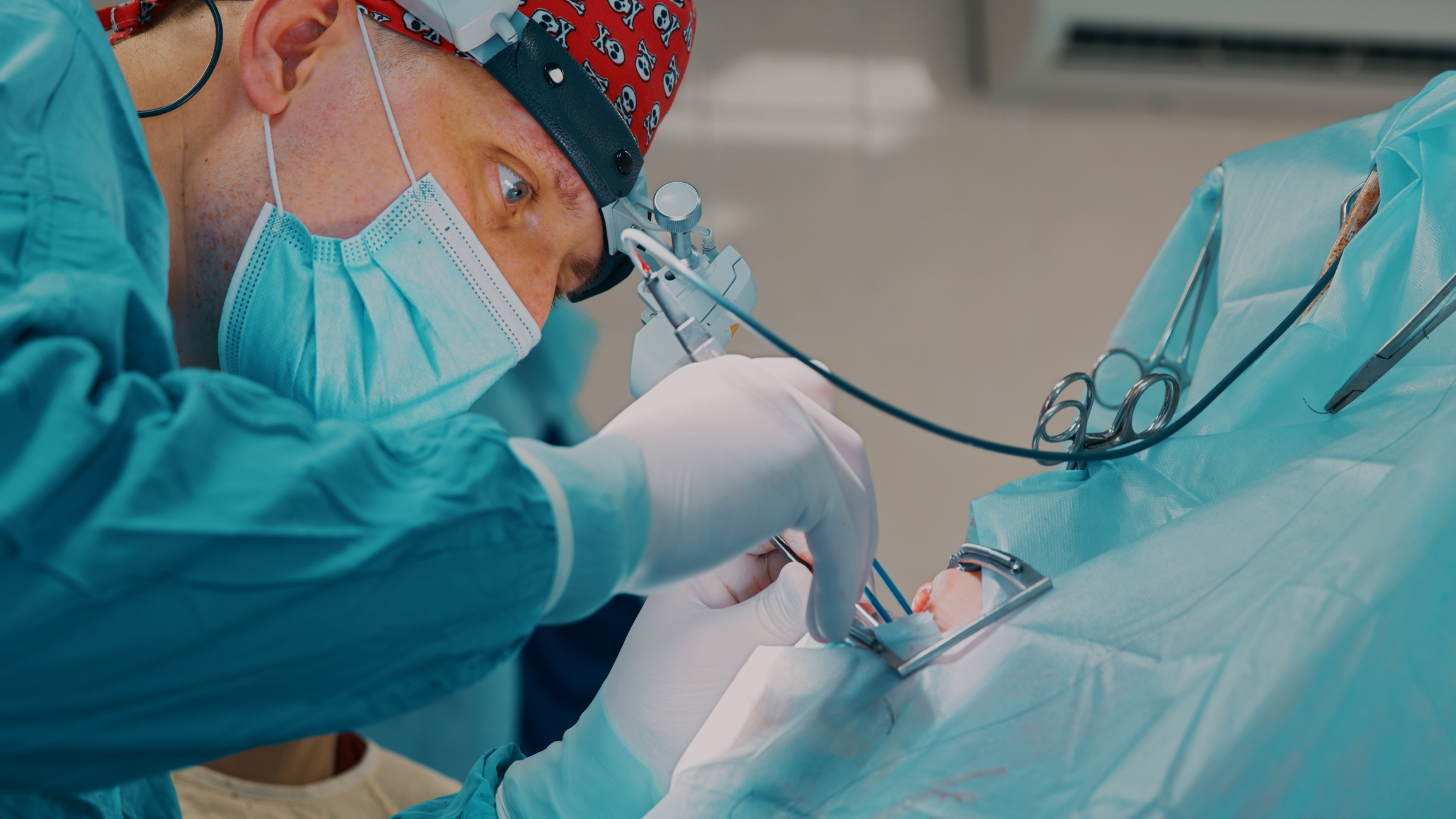 A surgeon is performing oral surgery