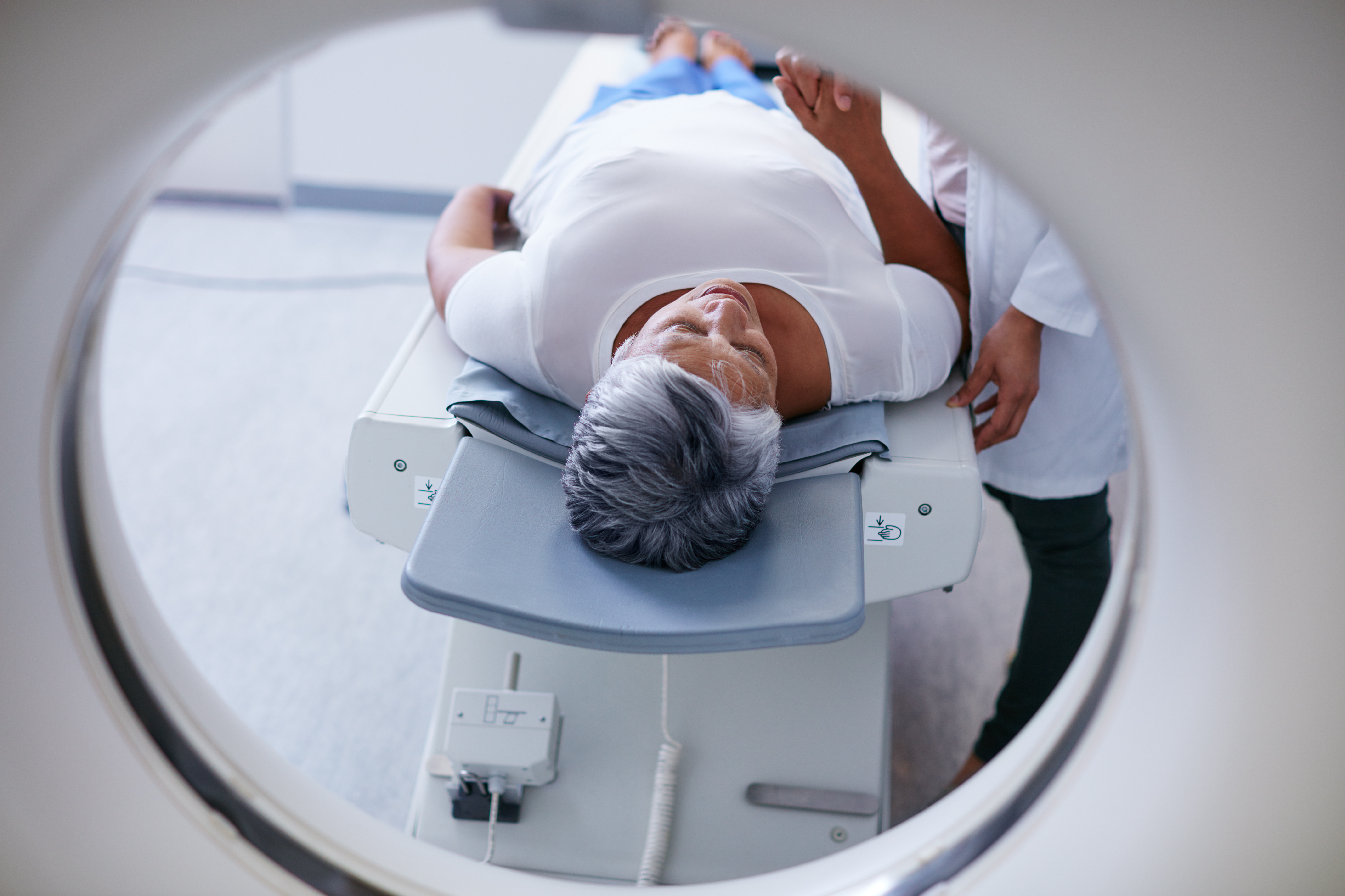 Senior woman going into diagnostic scanner