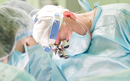 surgeon wearing medical eye wear whilst performing surgery