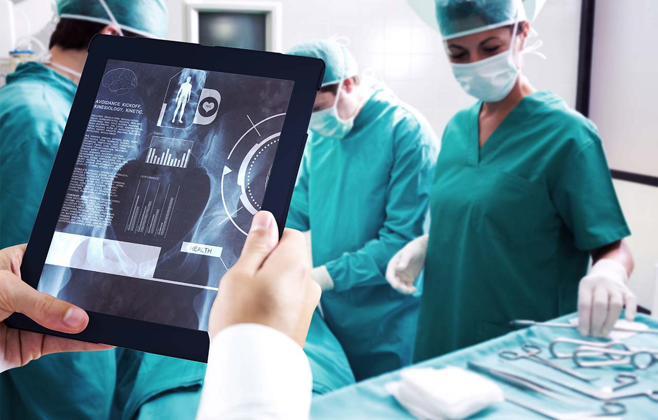 Close up of surgeons reviewing scans obtained through nuclear medicine diagnostic imaging