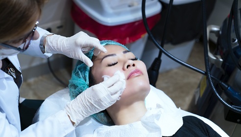 female patient having face prepped for surgery
