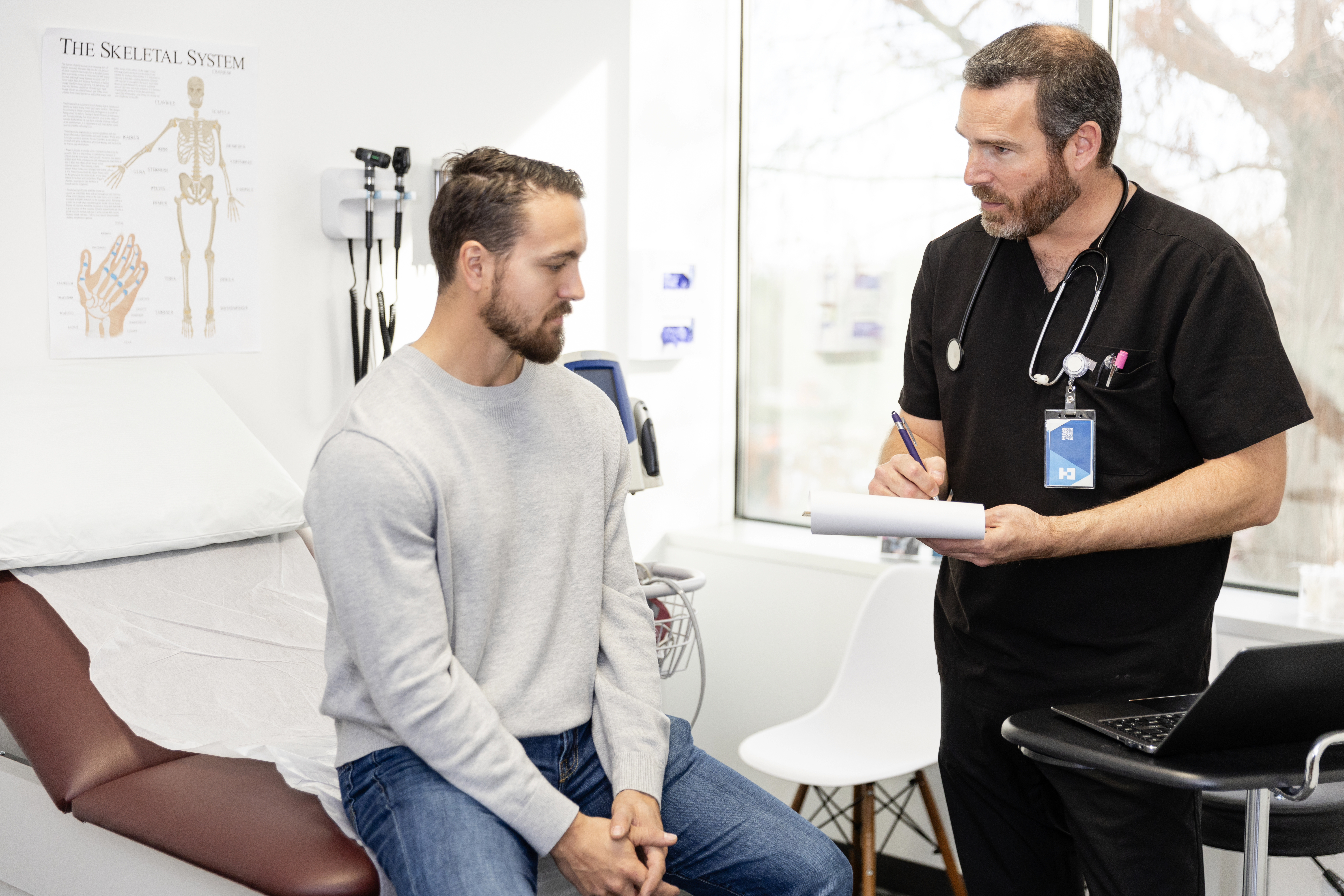 A male patient is listening to a doctor 